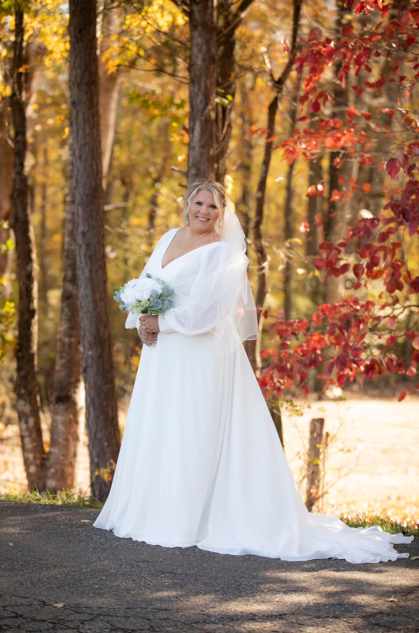 bride in fall tree line