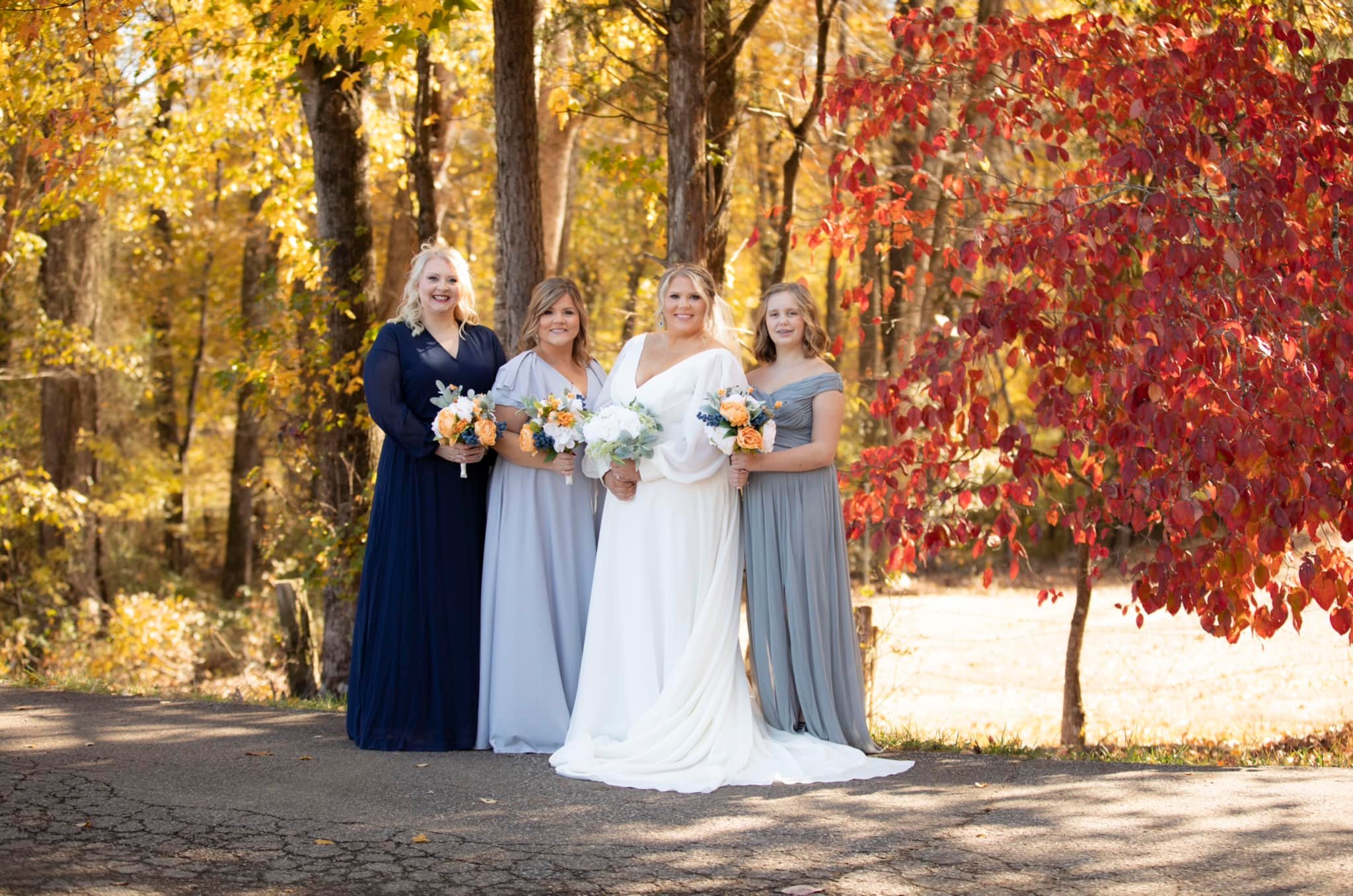 bride and bridesmaids posing with bouquets