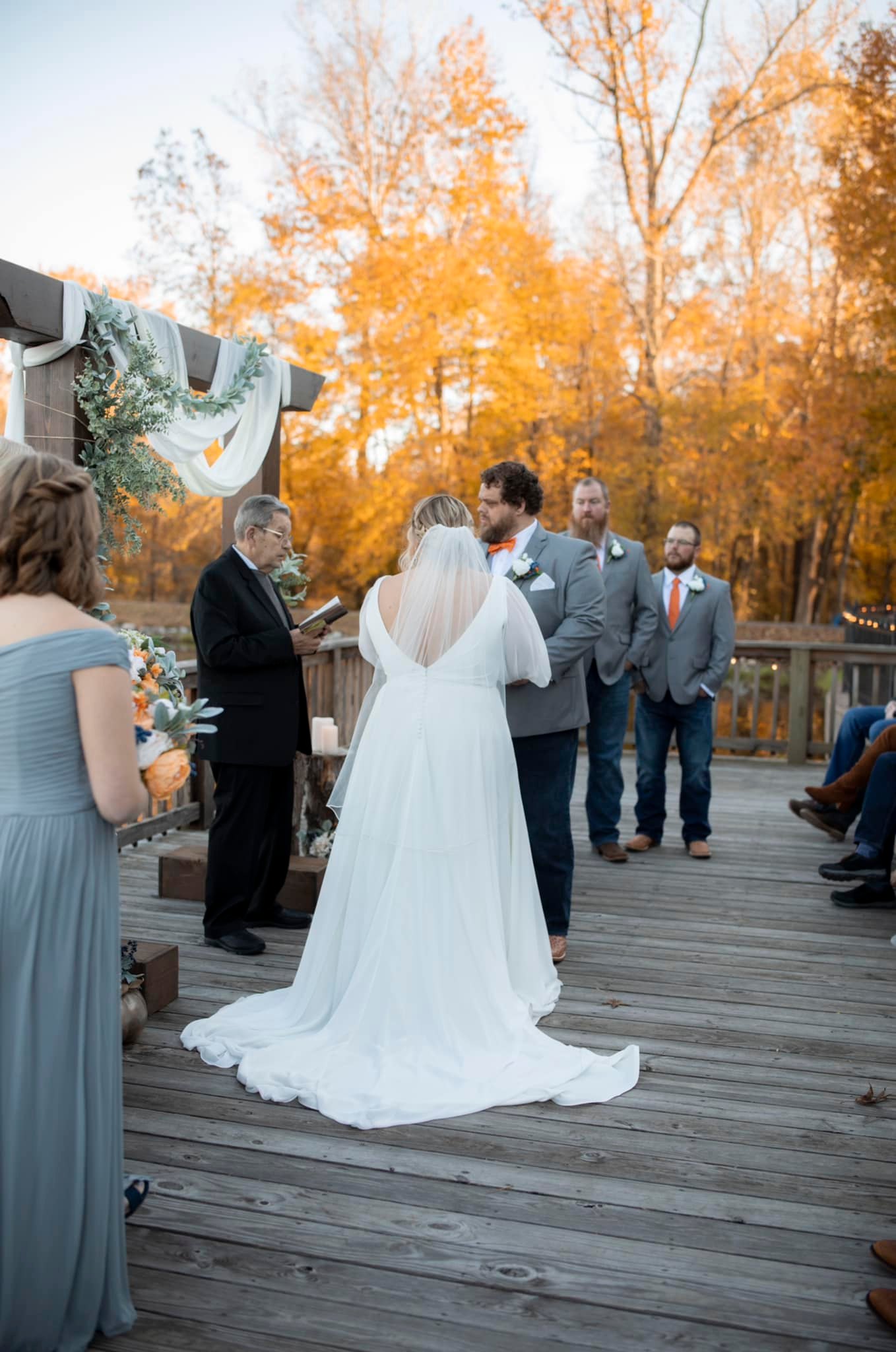 wedding officiant reads to bride and groom