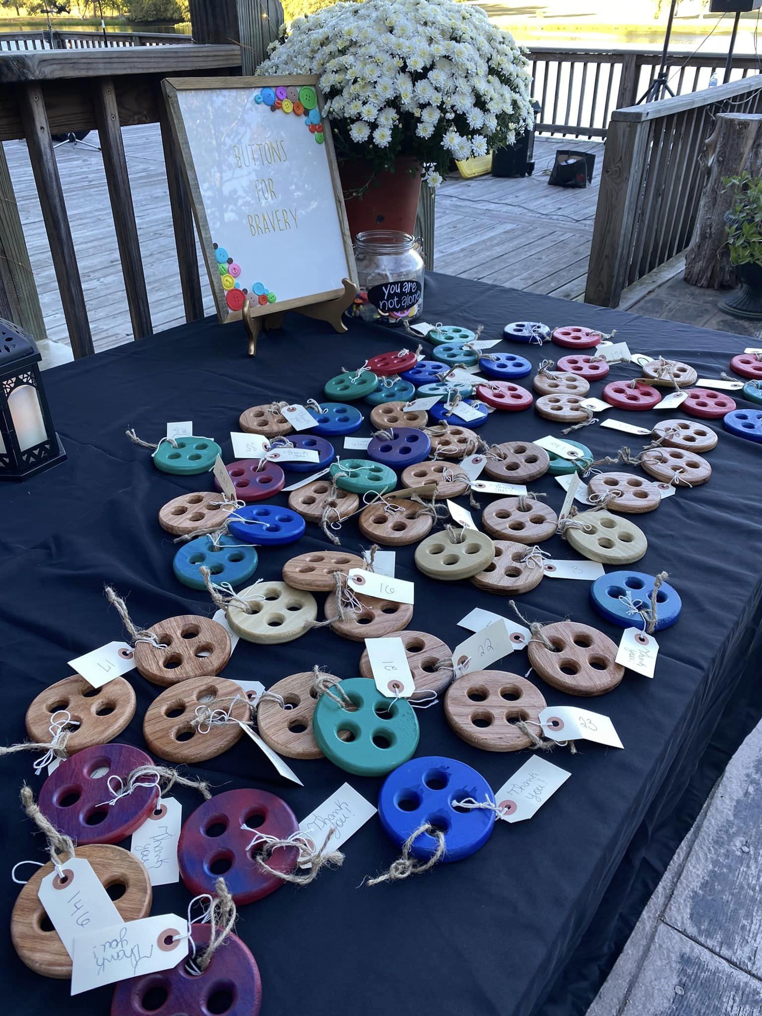 table holding button wedding favors