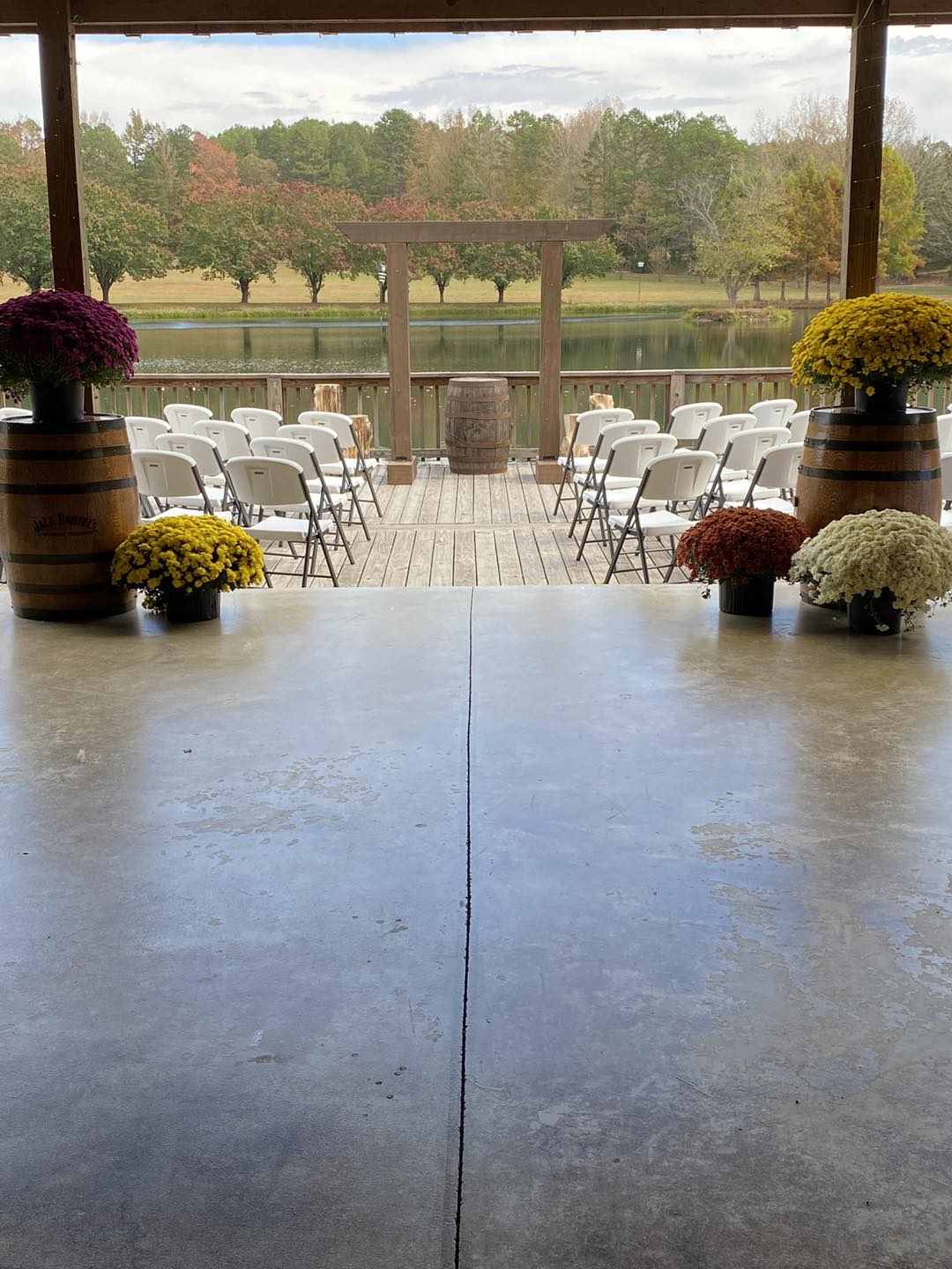 wedding aisle entrance surrounded by fall flowers