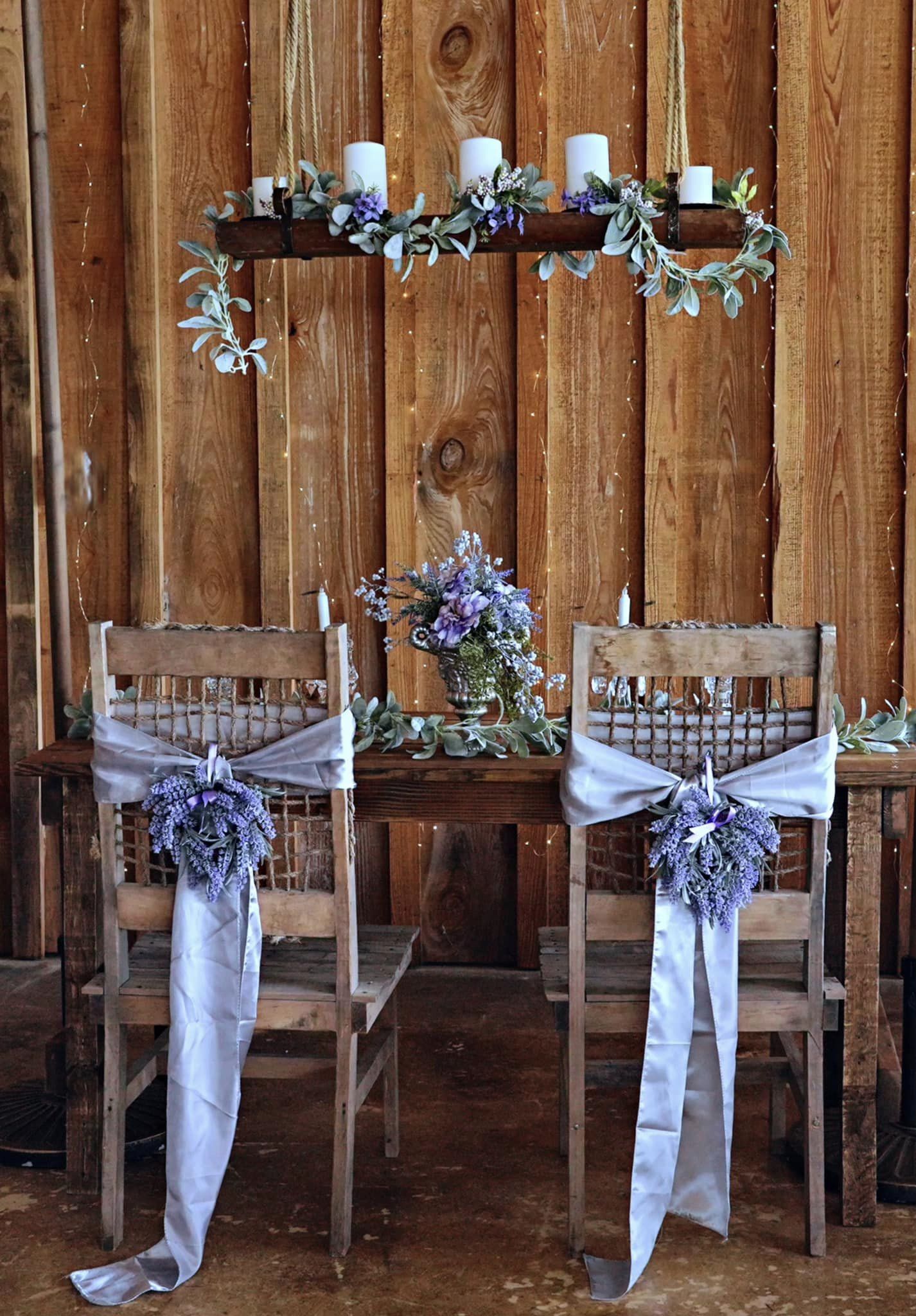 wedding reception table with purple and green flowers