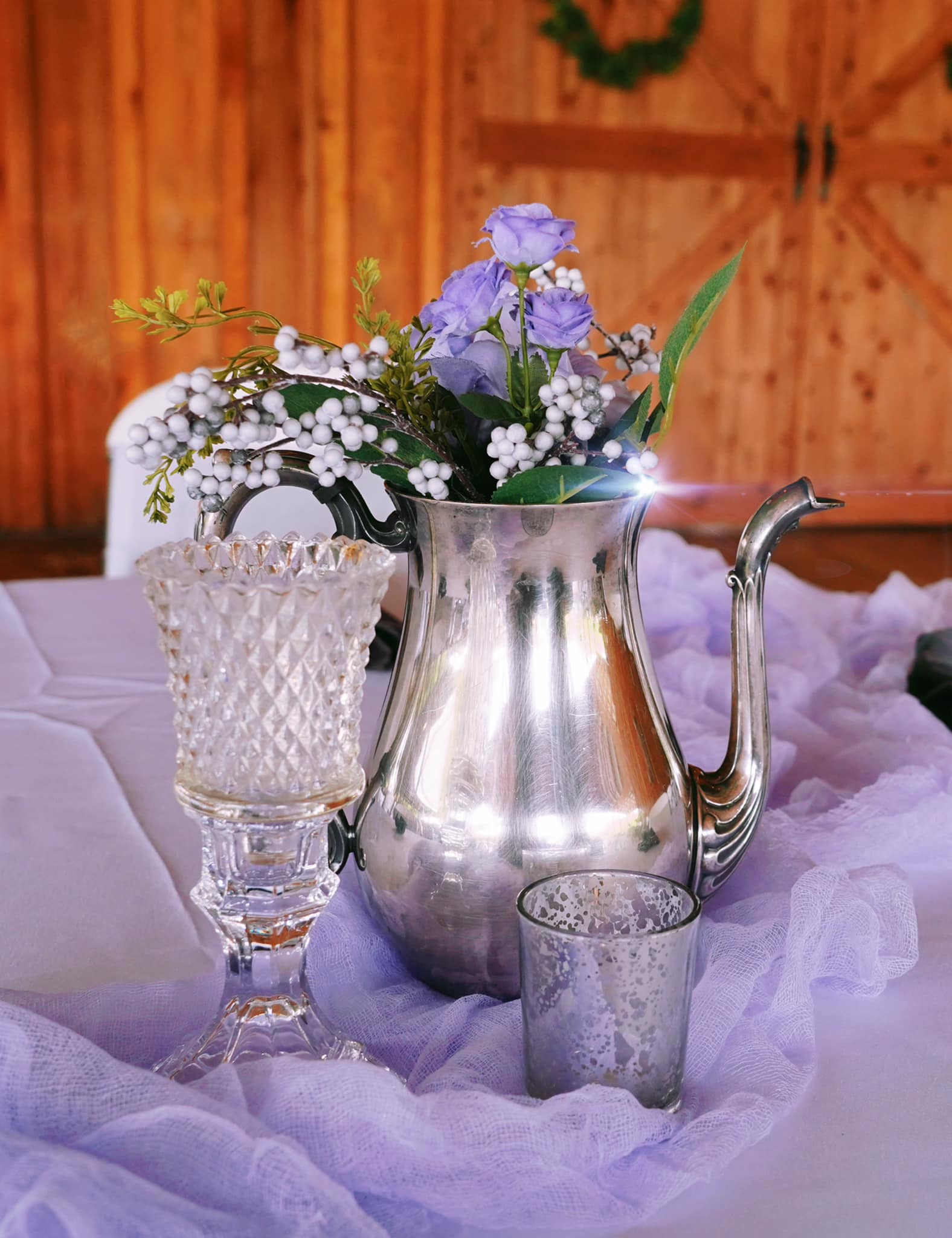 wedding table decorations with purple and white flowers in silver tea pot