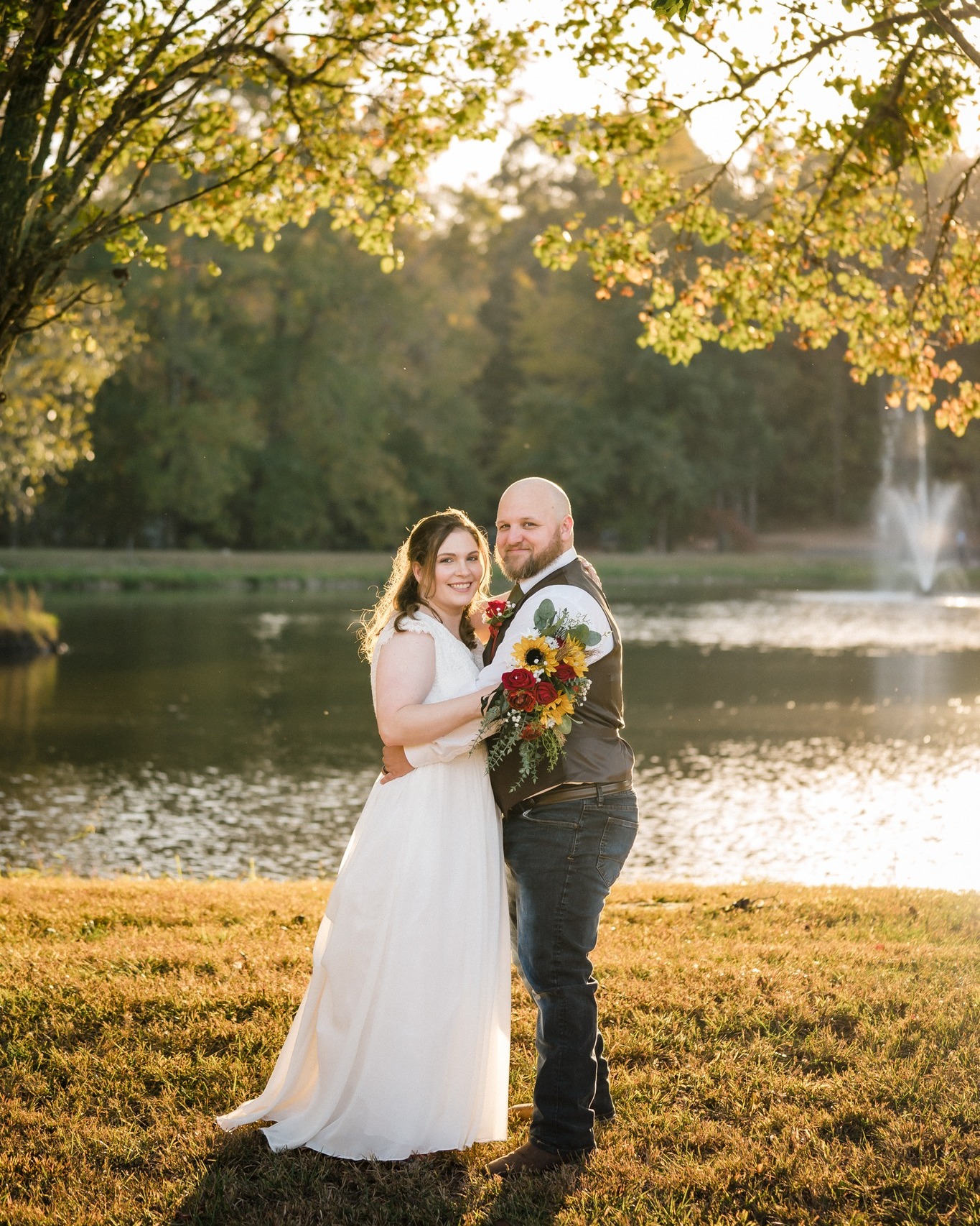 couple in front of lake and fountain