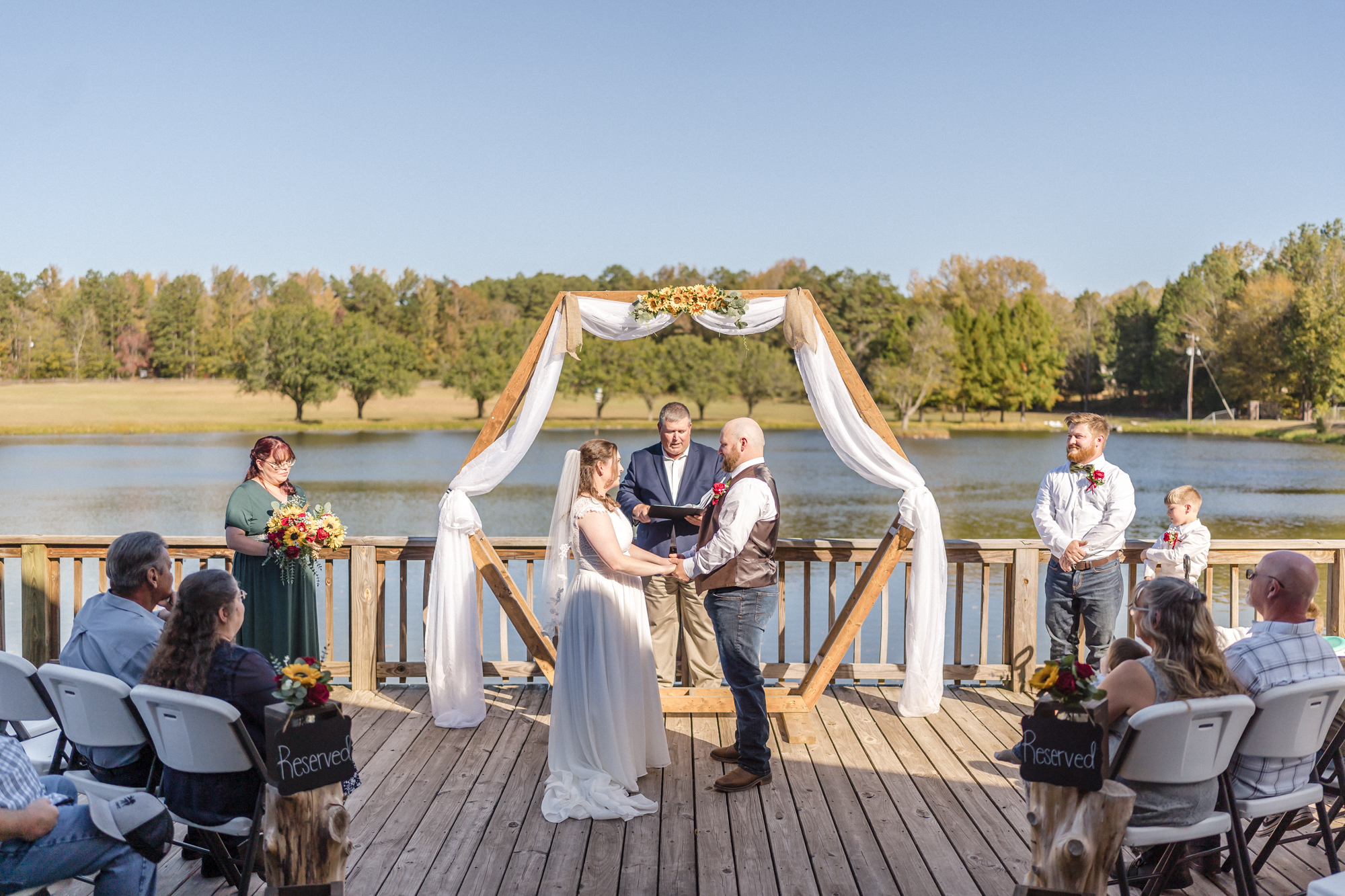 bride and groom say vows on venue deck
