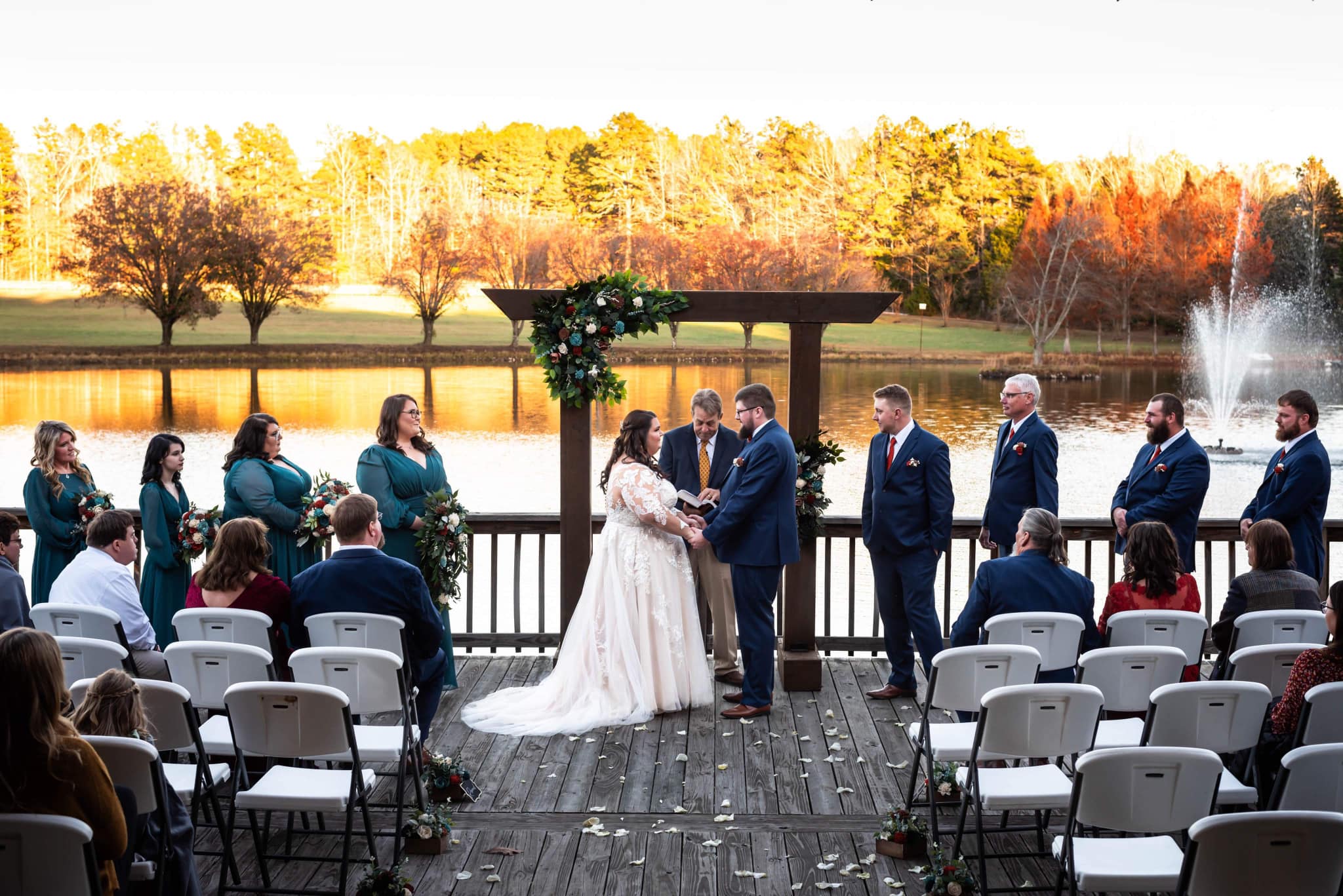 bride and groom share vows in the fall light