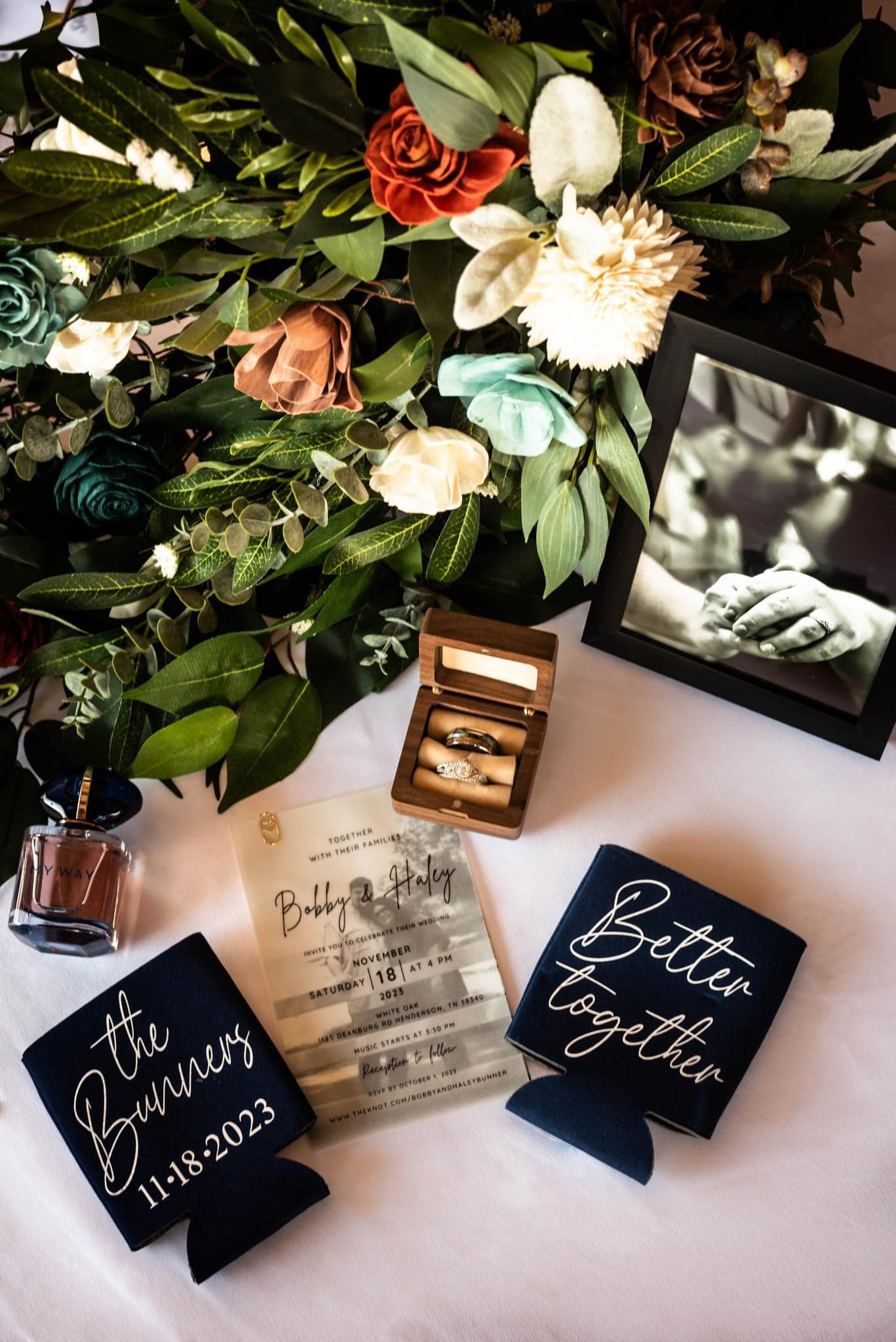 detail shot of rings with wedding invitation