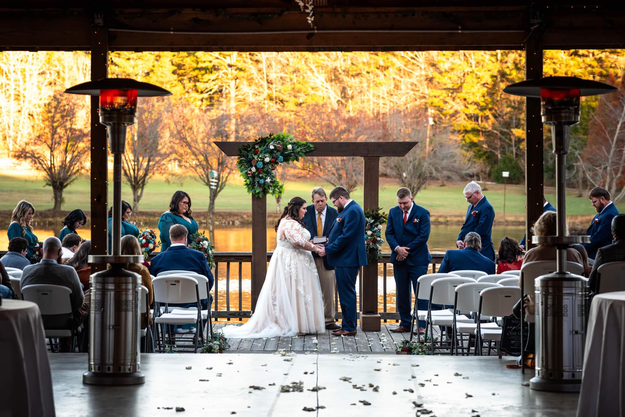 the officiant prays over the couple