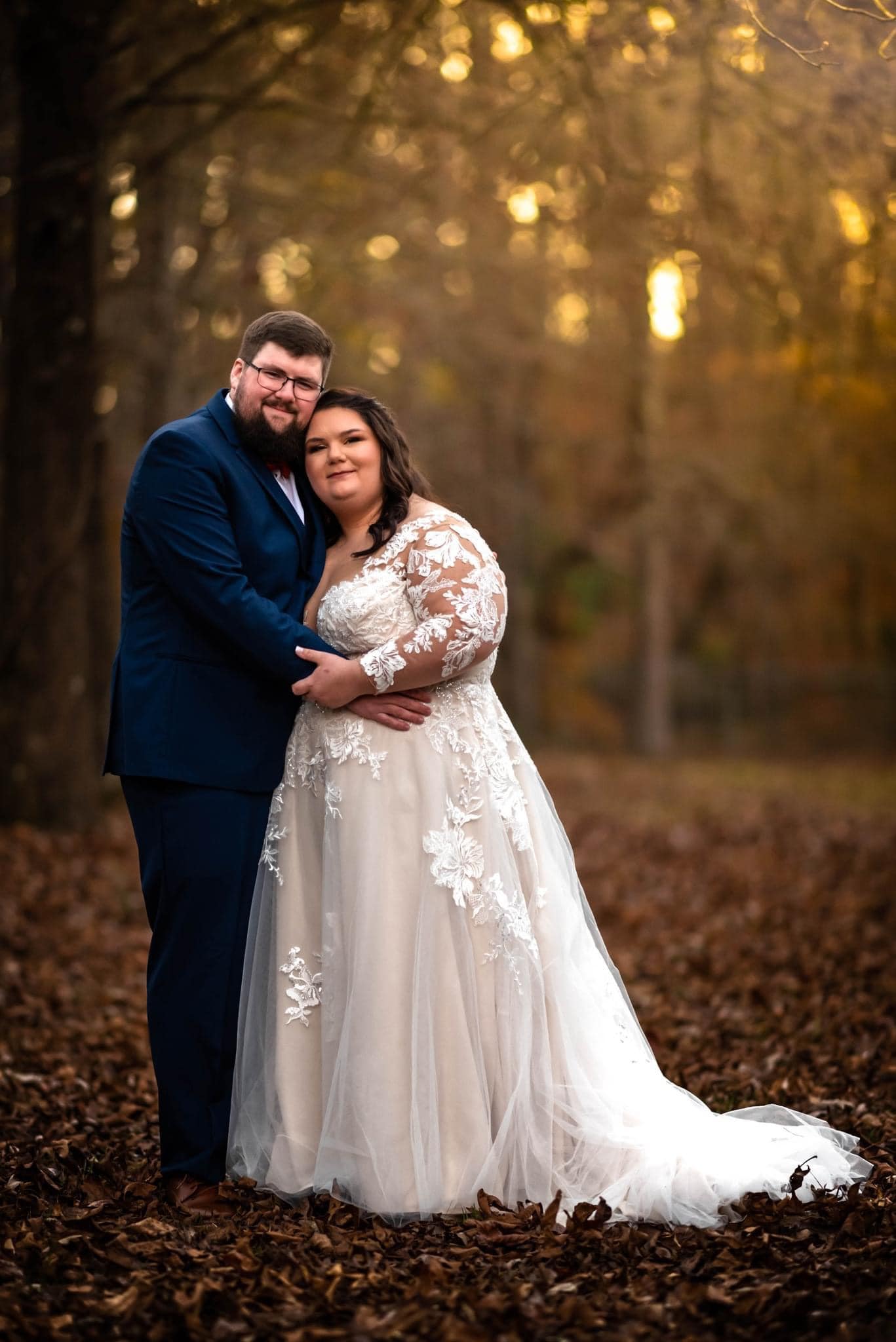couple posing in the fallen leaves