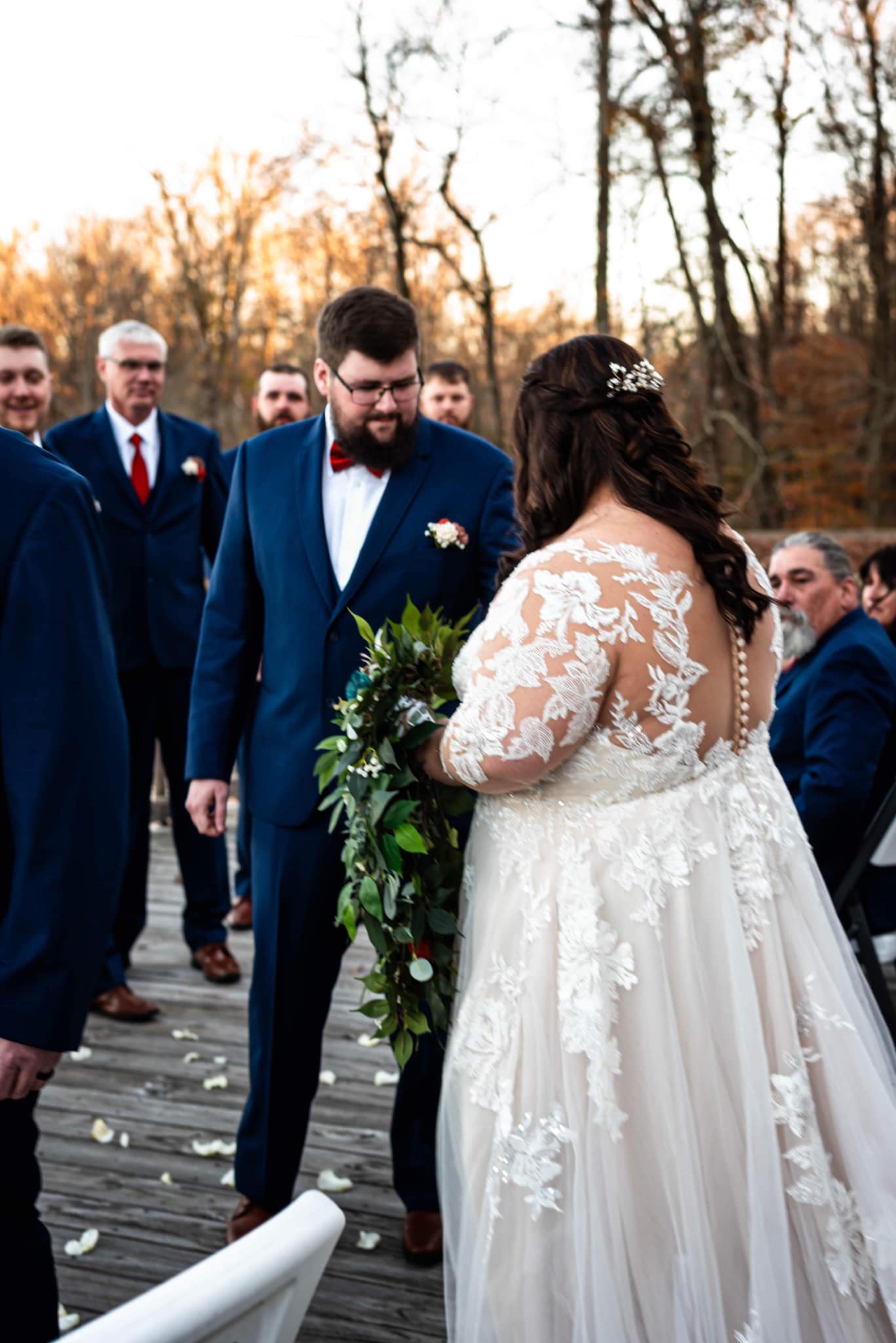 groom taking bride from father