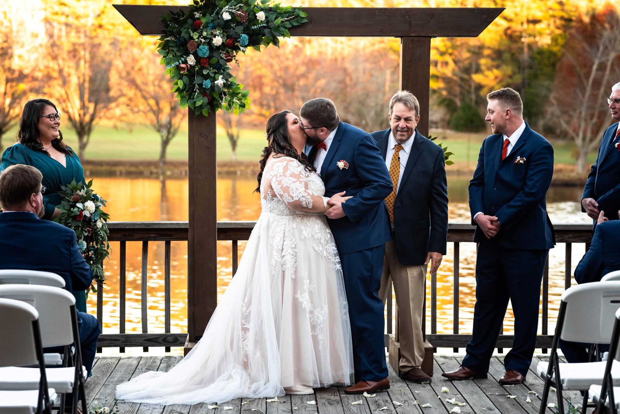 couple's first kiss as a married pair