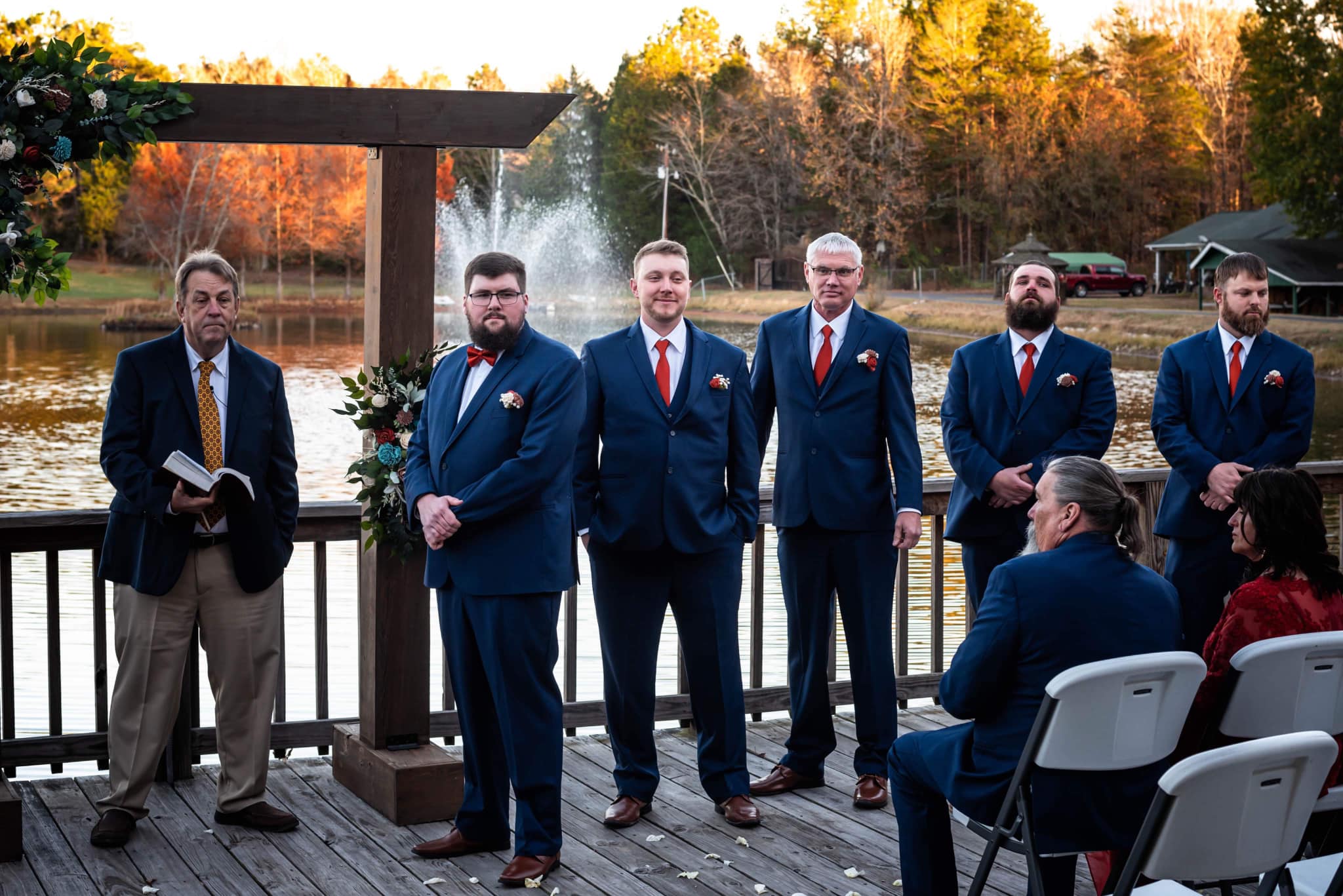groom watching the bride walk down the aisle